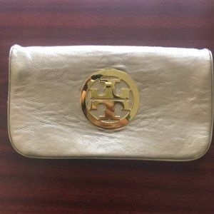 Metallic gold toned leather Tory Burch Reva Clutch